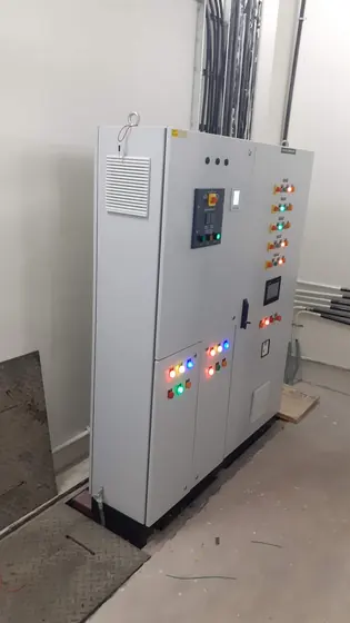 Tall control panel with display and lit indicators