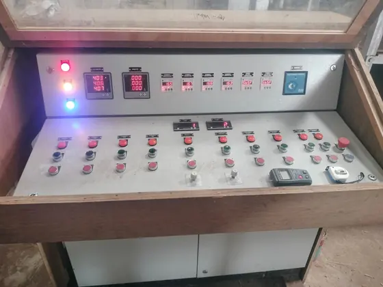 Operator desk panel with rows of switches and displays