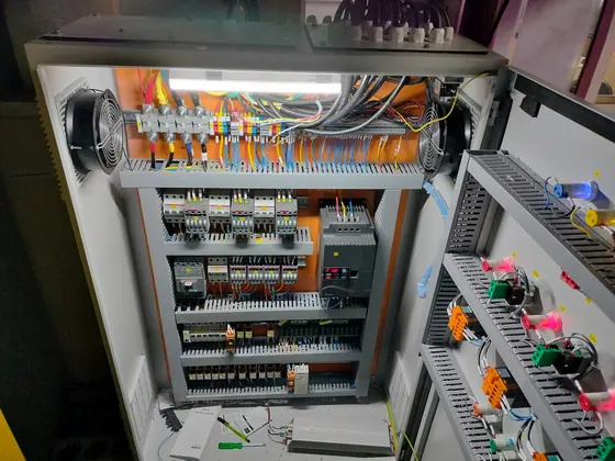 Panel interior with neatly wired contactors and ducts