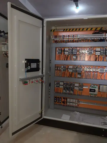 Panel door open showing a wired control section
