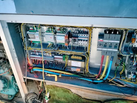 Panel interior with breakers and wiring on site