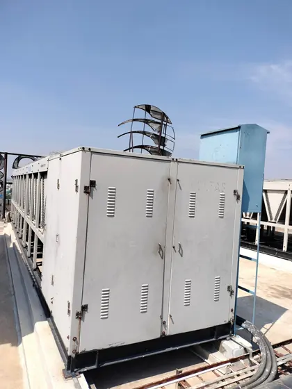 Panel enclosure mounted on a rooftop unit