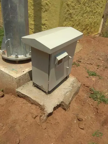 Small outdoor pillar panel on a concrete base