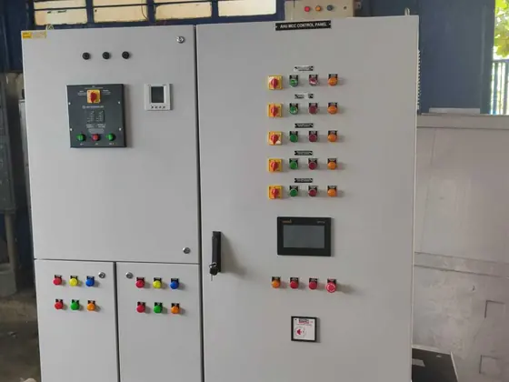 Control panel with HMI and rows of push buttons