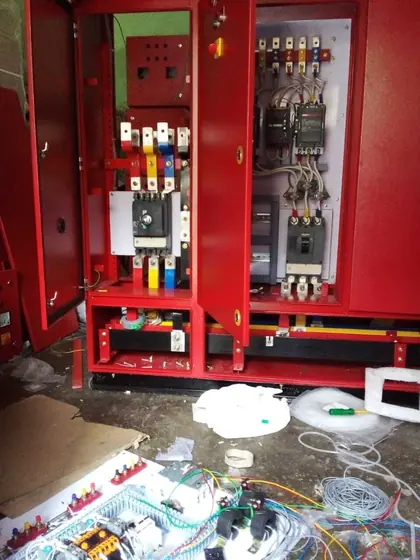 Fire pump controller panel with interior wiring during assembly